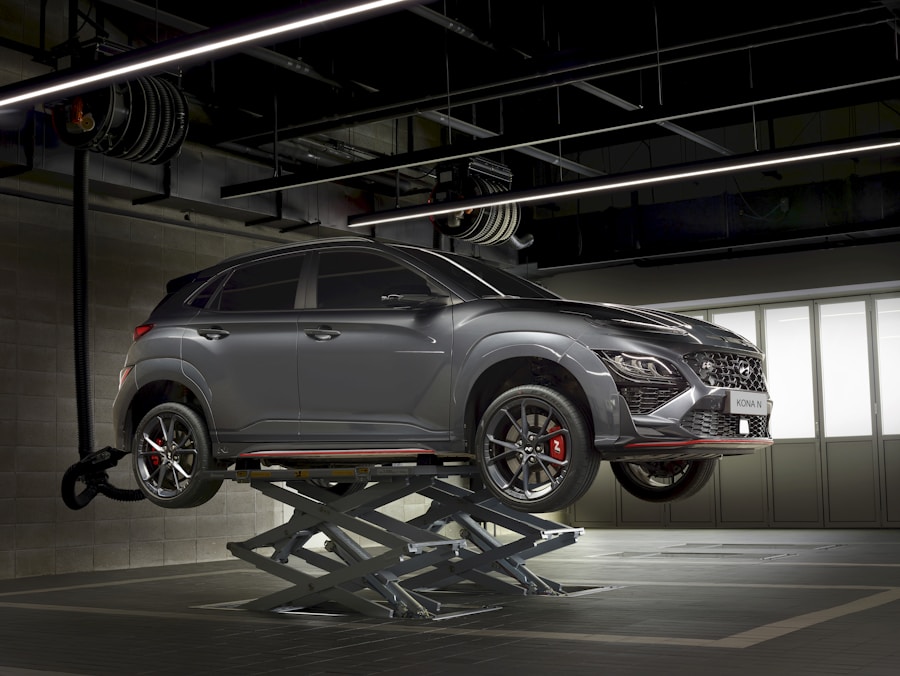 Vehicle on hydraulic lift in a professional auto workshop